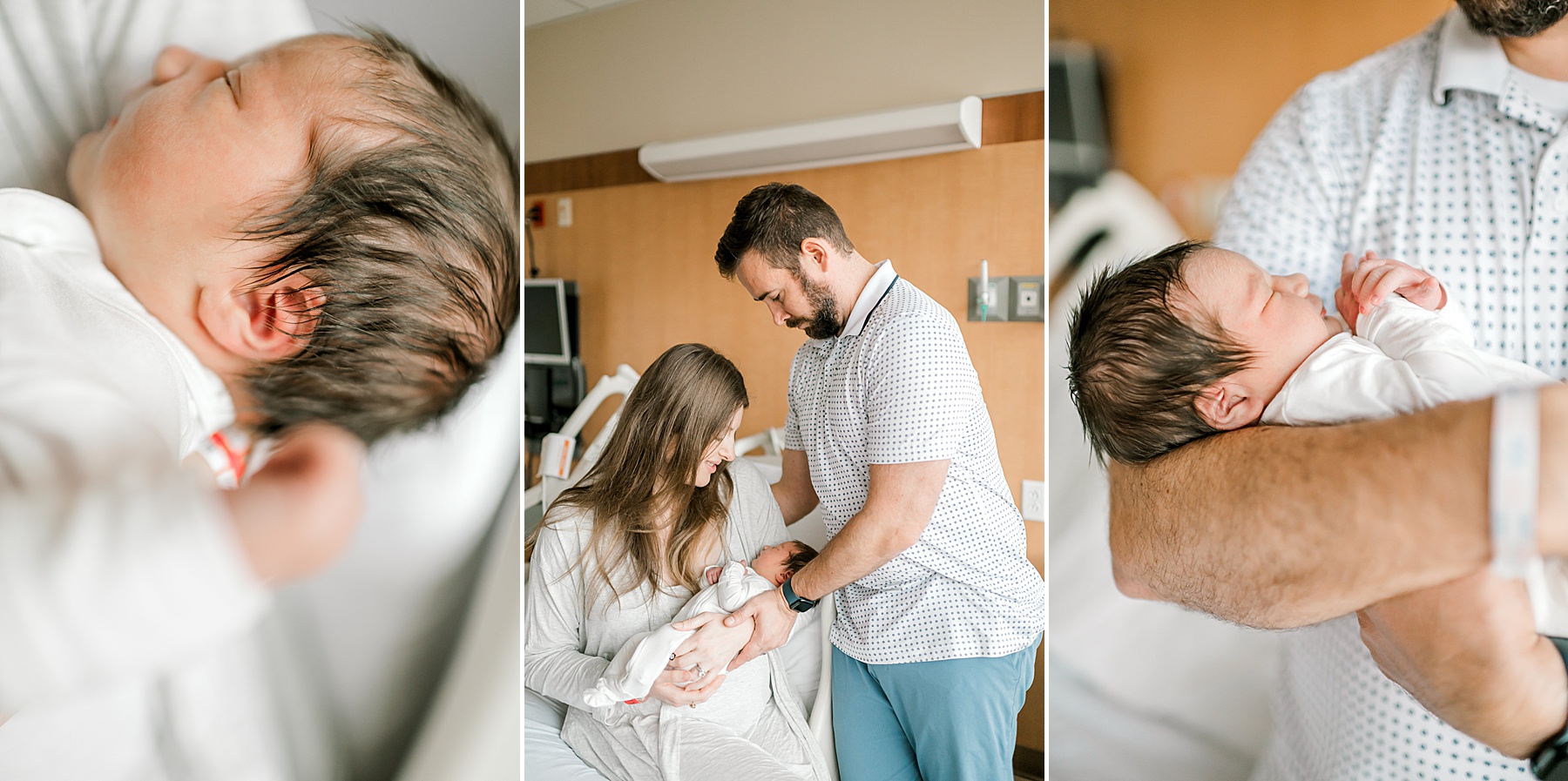 dad holds newborn girl in arms