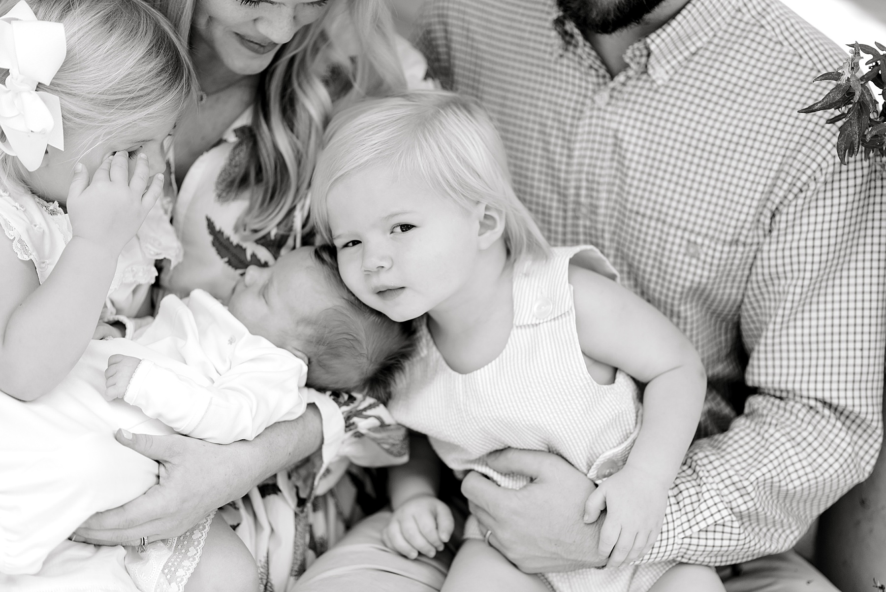 parents hold children in their arms