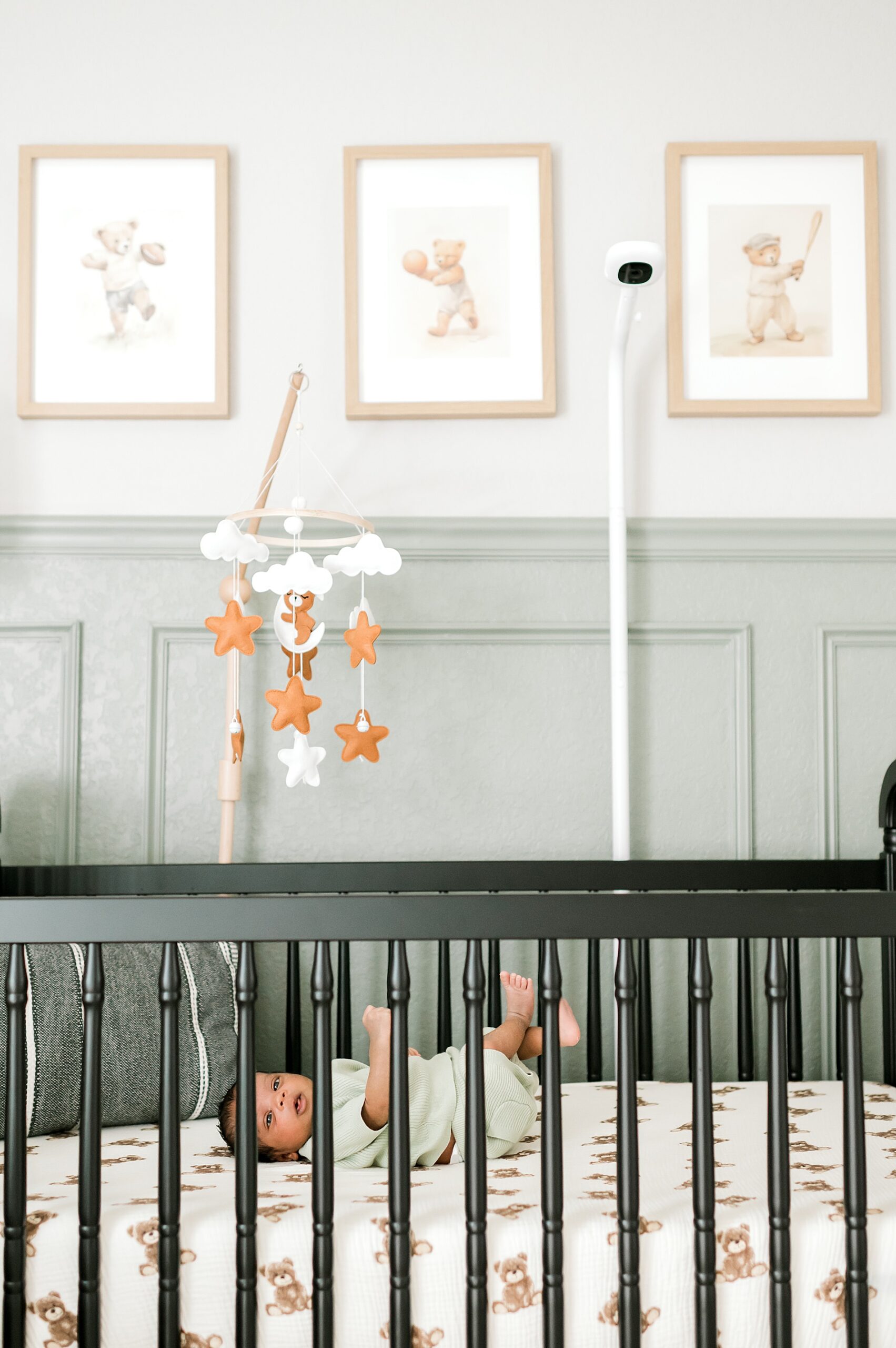 sweet newborn boy in crib