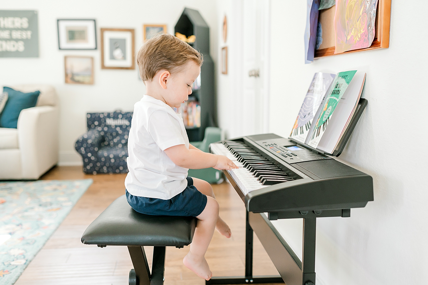 little boy playing on keyboard