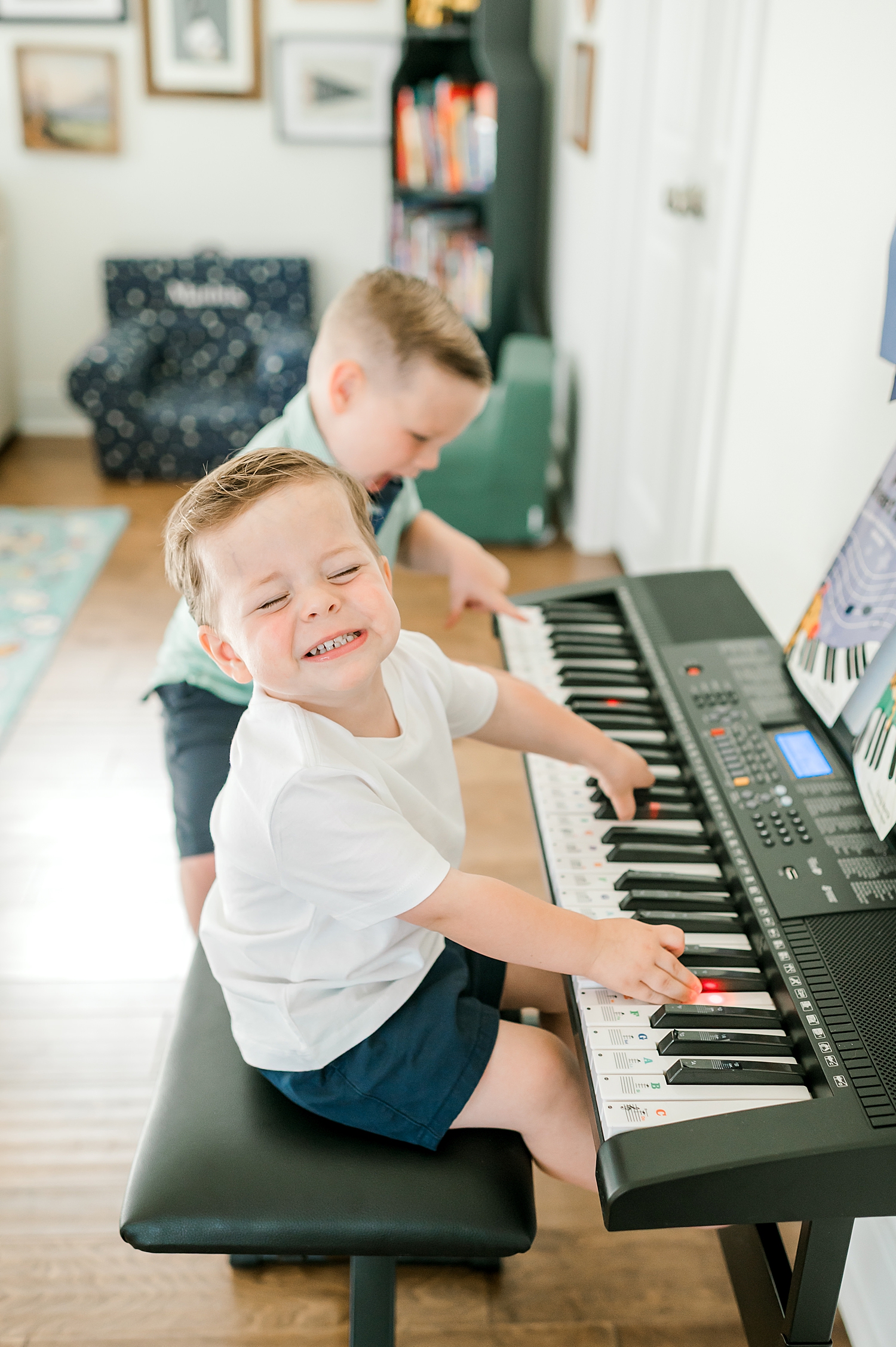 candid photos of little boys playing on keyboard