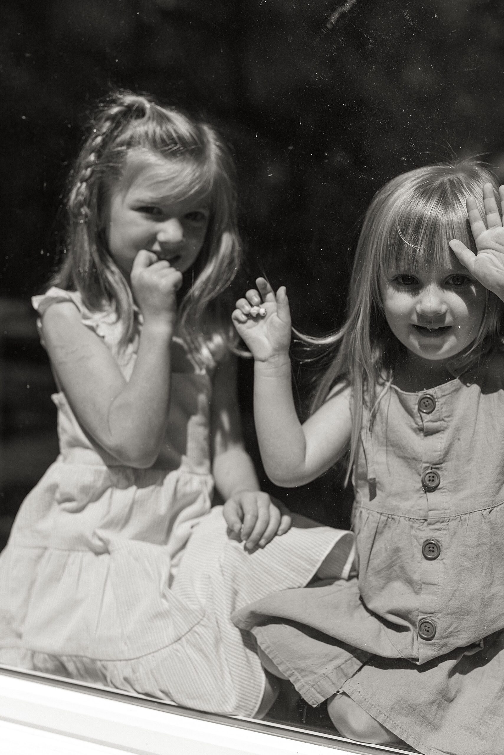 little girls in the window 