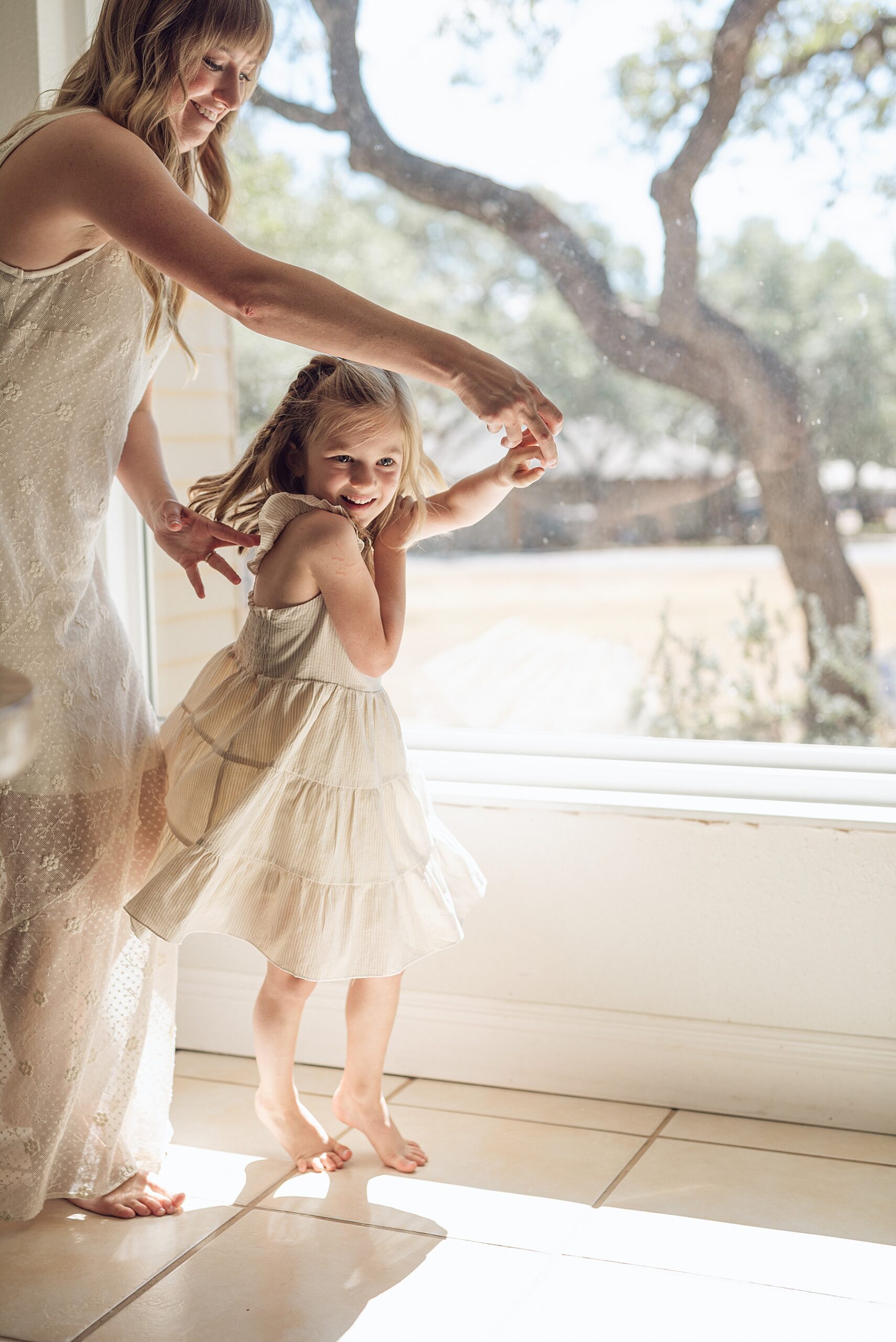 family by the window during in-home session 