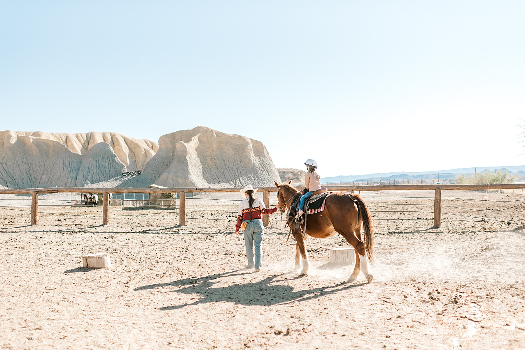 little girl rides a horse