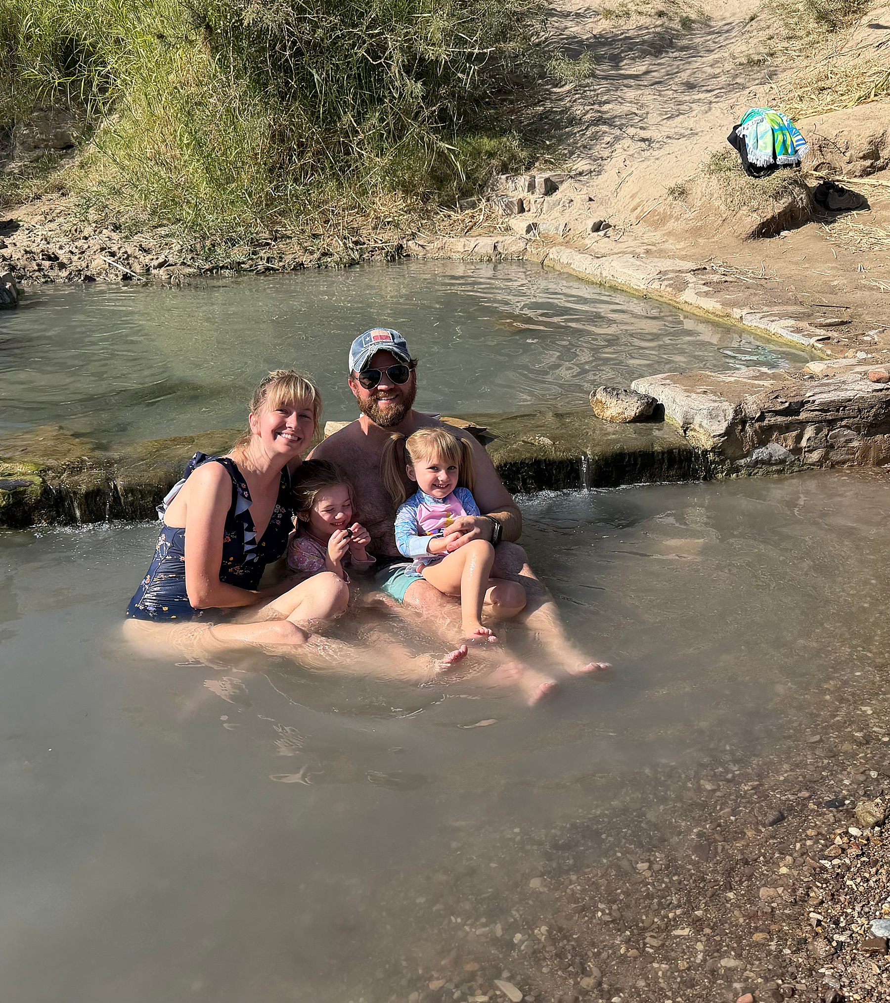 Family relaxes in the water during vacation