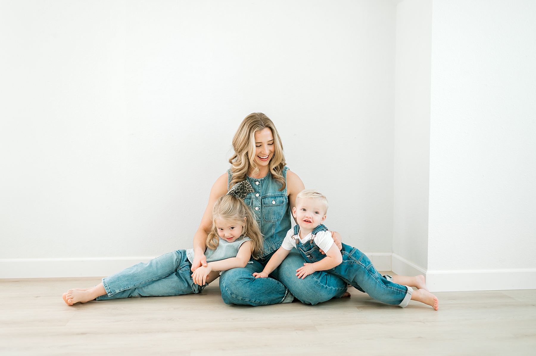 mom with two kids all dressed in denim