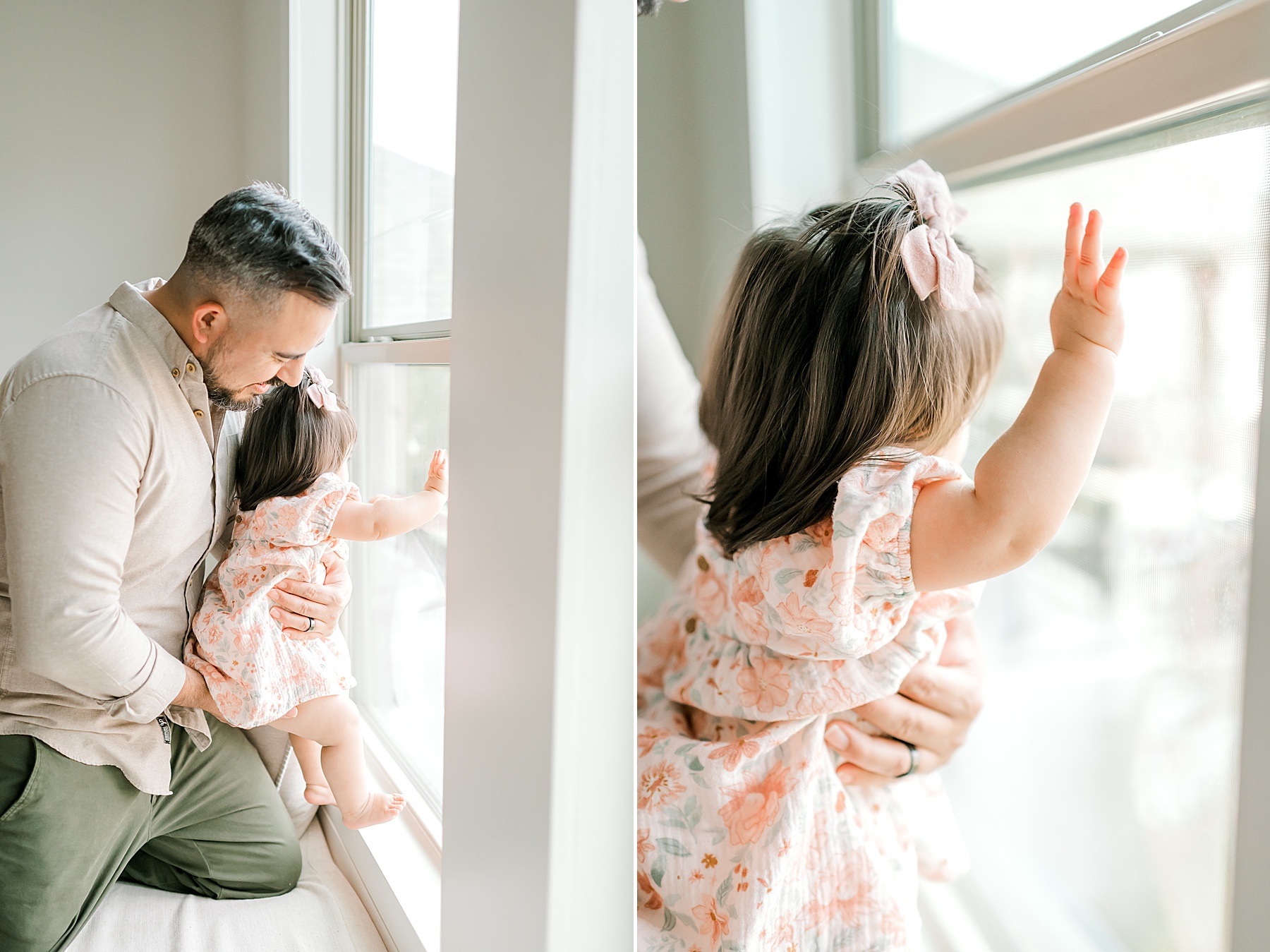 dad with little girl looking out window