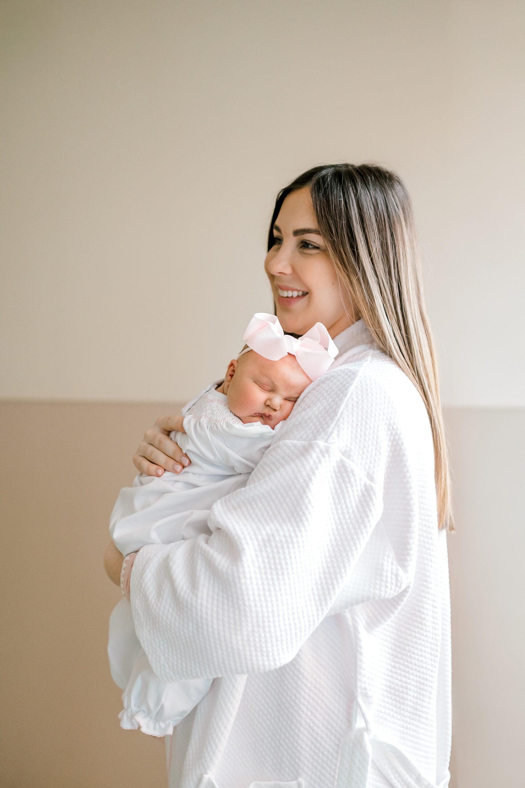 mom holds newborn in San Antonio fresh 48 session