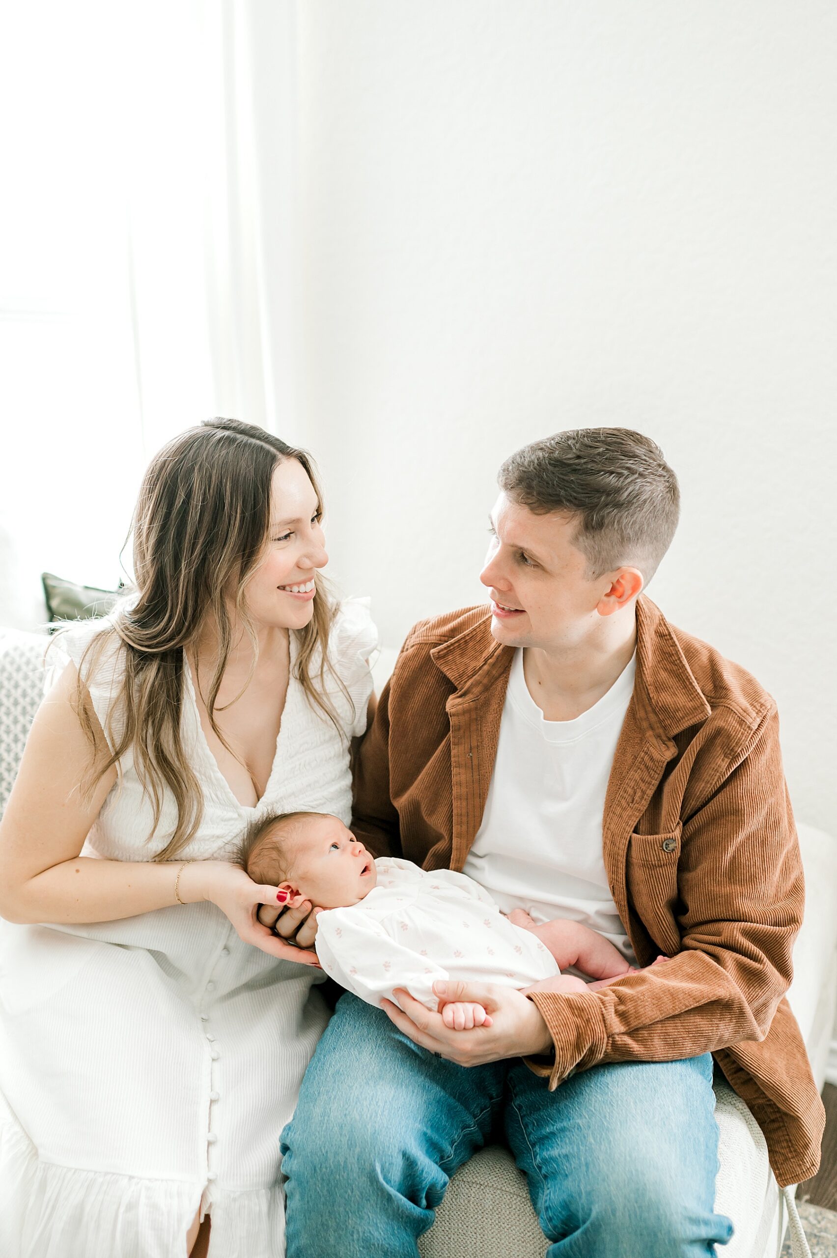 new parents with baby during in-home newborn session